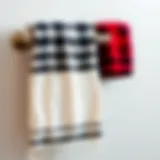 Sophisticated Display of Buffalo Plaid Towels Elegant buffalo plaid bathroom towel draped over a stylish towel rack