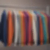 A collection of colorful basic sweatshirts displayed on a rack, showcasing variety.