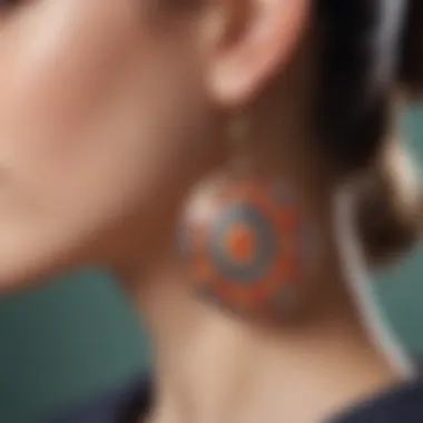 Close-up of intricate patterns in resin earrings reflecting light