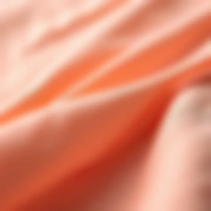 Close-up of fabric texture of peach colored plus size tops