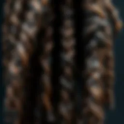 Close-up of intricately styled single ended dreadlock extensions showcasing texture and color variations.