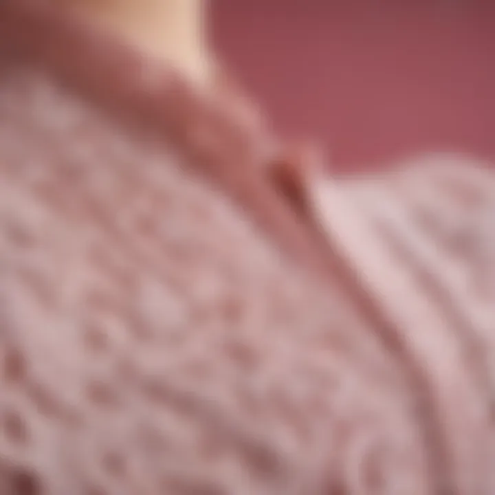 Close-up of intricate lace detailing on a pink top