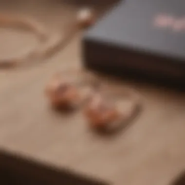 Elegant rose gold ear stretching kit displayed on a wooden surface