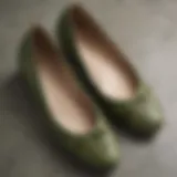 Close-up of olive green flat shoes showcasing intricate details and texture