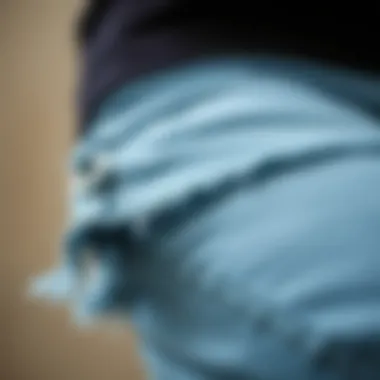 Close-up of the frayed hem detail showcasing craftsmanship.