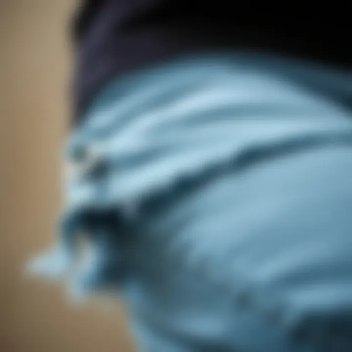 Close-up of the frayed hem detail showcasing craftsmanship.