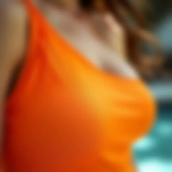 Intricate Design Features of the Orange One Shoulder Swimsuit Close-up of the fabric texture and design details of the orange one shoulder swimsuit