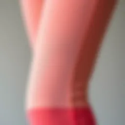 Close-up view of peach booty leggings showcasing fabric texture and design