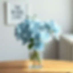 Elegant arrangement of ice blue artificial flowers in a minimalist vase.