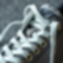 Close-up of extra long white shoelaces against a textured background