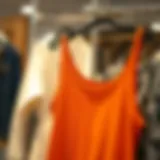 A stylish tank top in a vibrant color hanging on a rack.